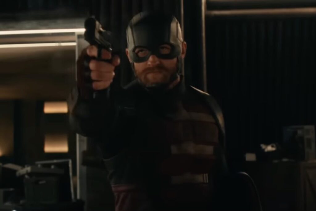 Masked bearded man in US Agent suit pointing a gun