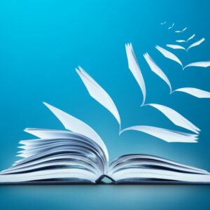 Conceptual image of reading book with pages flying away