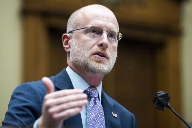 Federal Communications Commission Commissioner Brendan Carr speaks and gestures with his hand while testifying at a Congressional hearing