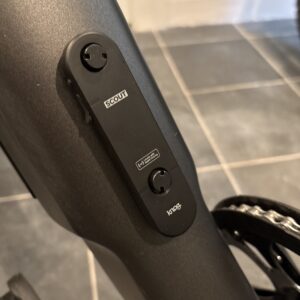 Image of a black plastic oval attached to a grey bike frame.