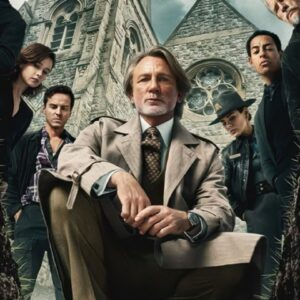 Benoit Blanc in light tan suit kneeing while standing suspects are arranged behind him in front of a church